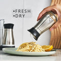 Salt and Pepper Shaker Set – 2-piece set, with stand, made of stainless steel and clear glass, with a twist-open lid with lettering, for kitchen and table decoration